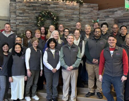 Photo of a group of about 30 people with Washing Poison Center vests on