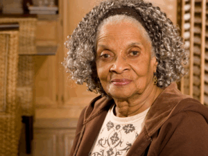 portrait of an older black woman slightly smiling